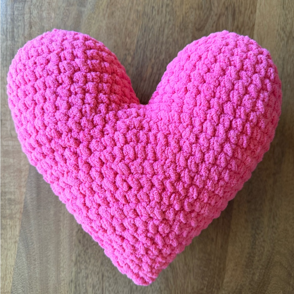 Pink heart-shaped decorative pillow